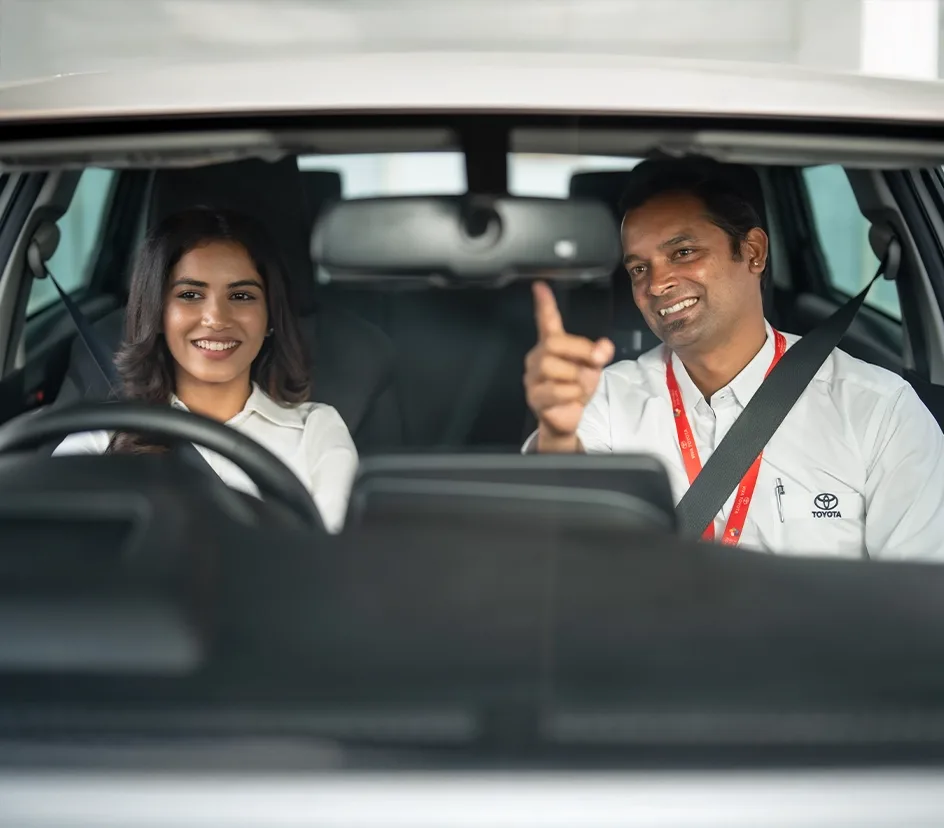 Learner and TDRIVE instructor giving a thumbs-up in the car