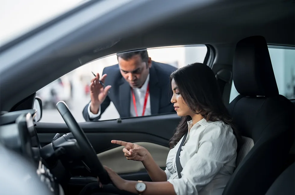 TDRIVE instructor guiding a learner at the wheel